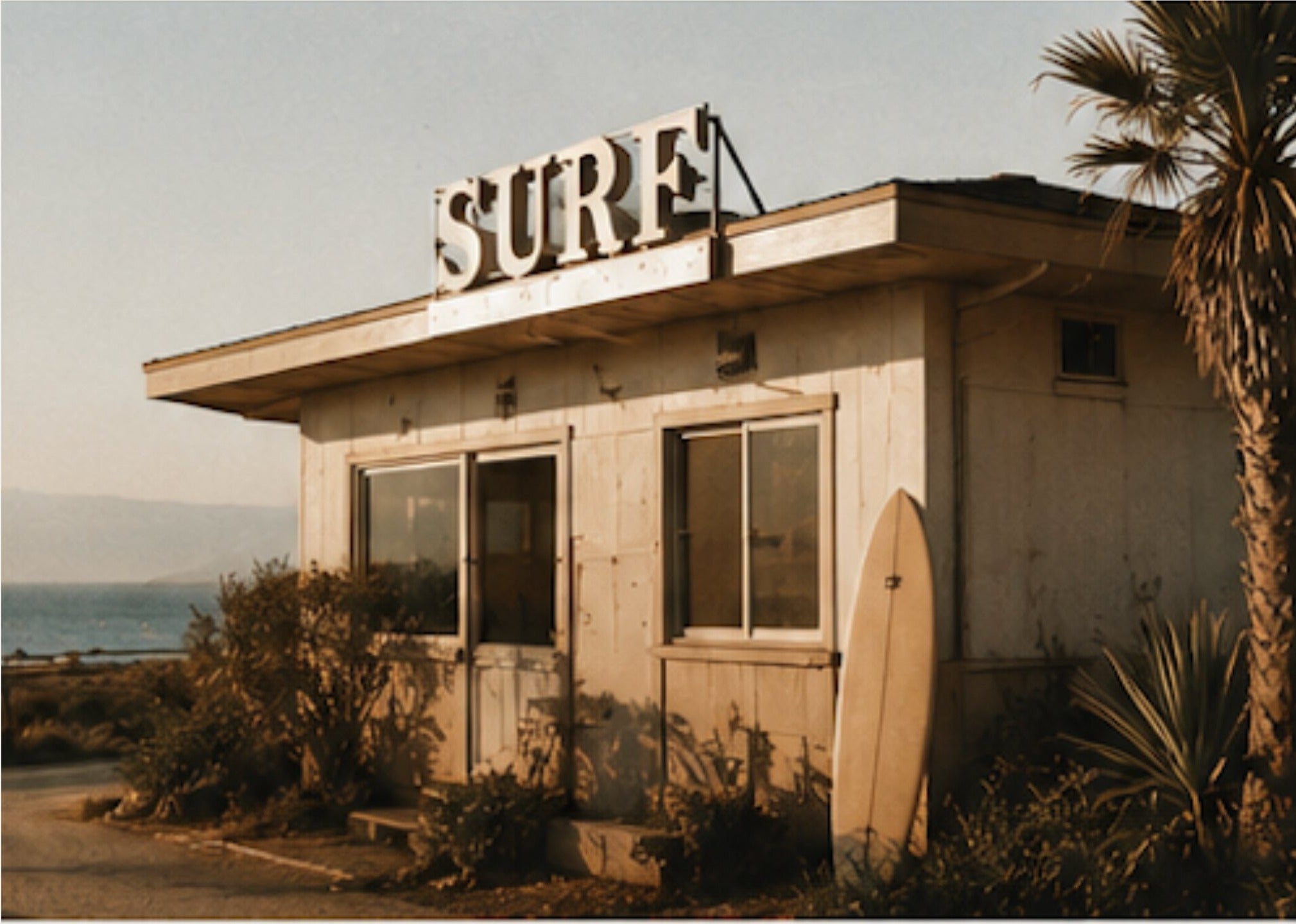 weathered surf shack at golden hour by the coast